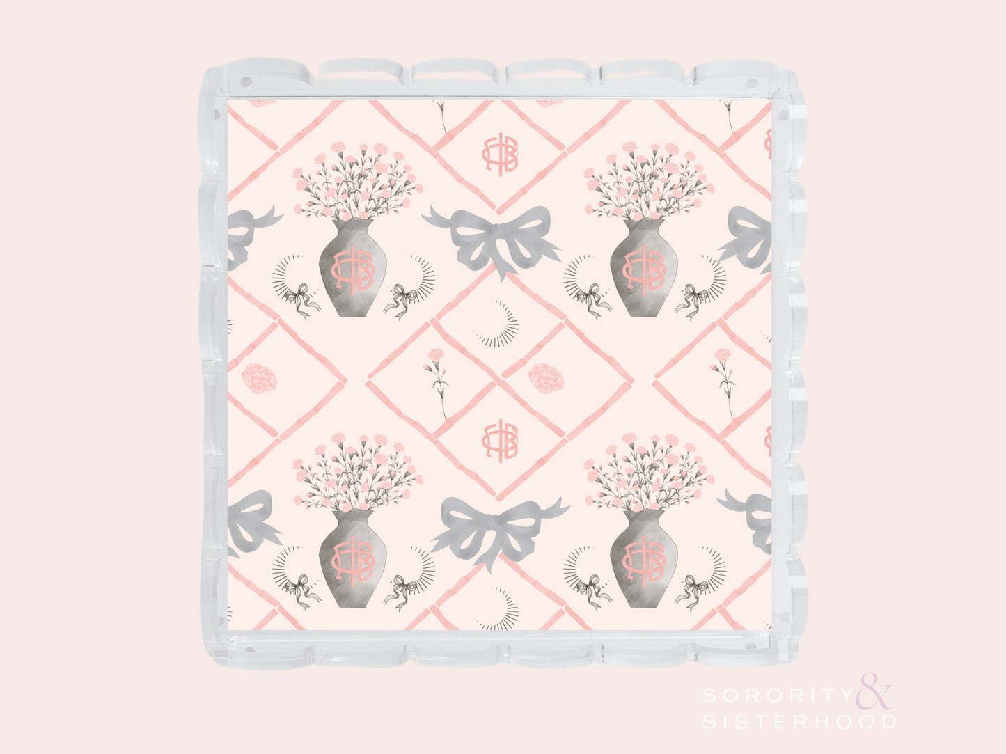 White ceramic tray with scalloped edges, pink diamond pattern, floral vases, bows, and Gamma Phi Beta symbols.