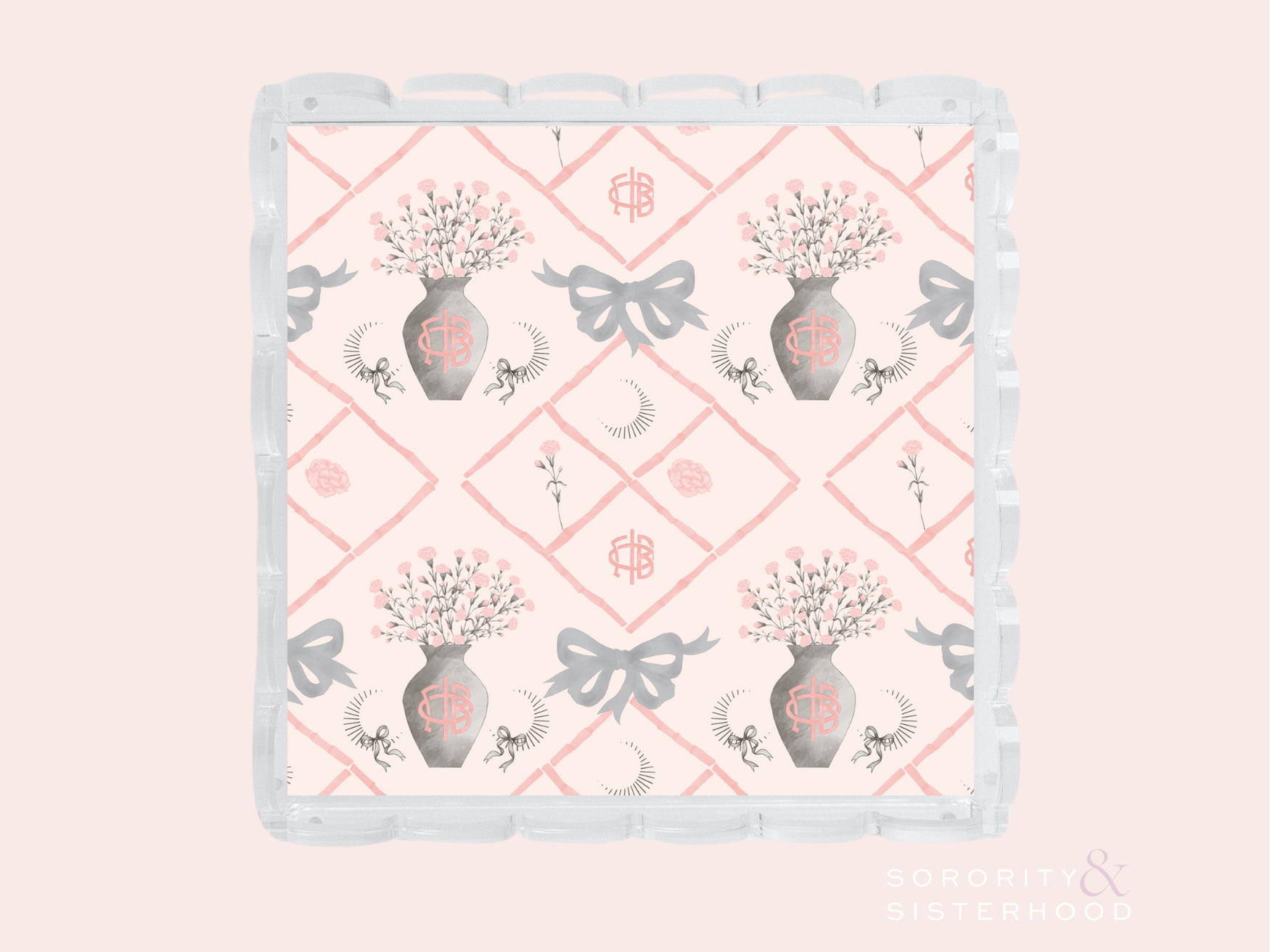 White ceramic tray with scalloped edges, pink diamond pattern, floral vases, bows, and Gamma Phi Beta symbols.