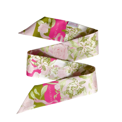 Floral scarflette with pink, white, and green pattern and Delta Zeta crest accents.
