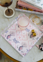Square scalloped tray with pink bows, floral motifs, and gold detailing on white background.