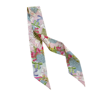 Silk Mahjong-themed scarflette with pastel pink, blue, and green tiles and floral accents.