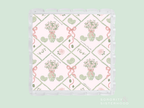 Square acrylic tray with scalloped edges, featuring pink and green floral and ribbon design on white background.
