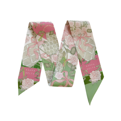 Pink and green floral Kappa Delta Heirloom Scarflette with intricate ribbon and rose pattern.