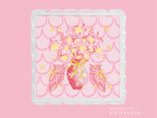 Clear acrylic tray with scalloped edges and pink and gold floral Chi Omega design.