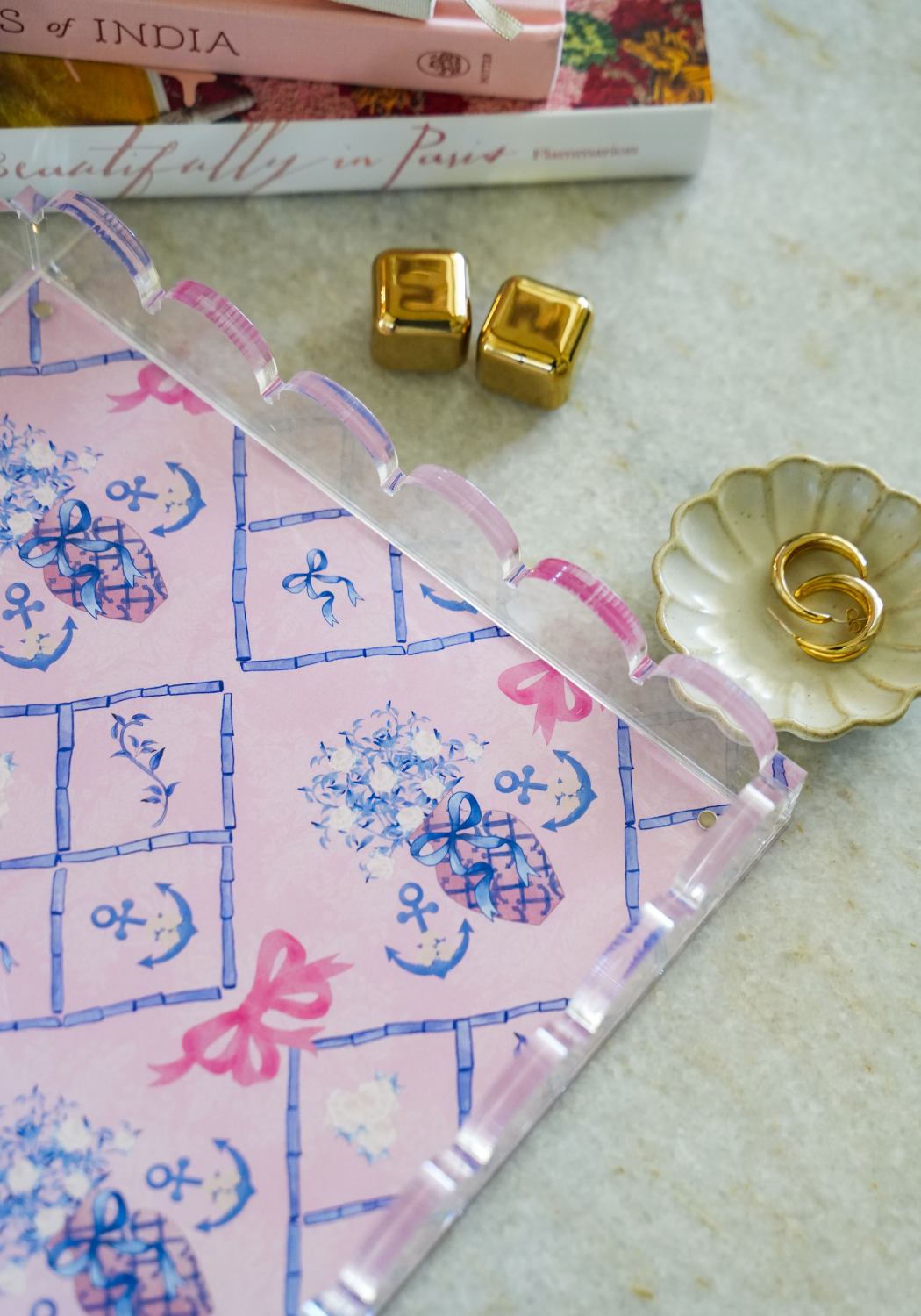 Clear acrylic tray with scalloped edges, pink border, and blue hand-drawn Delta Gamma symbols.