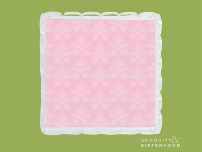 Square acrylic tray with scalloped edges and pink damask patterned center.