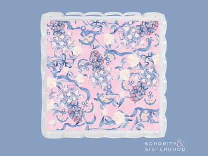 Acrylic tray with scalloped edges featuring a pink background and blue floral design.