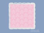 Square acrylic tray with scalloped edges and pink damask pattern interior.