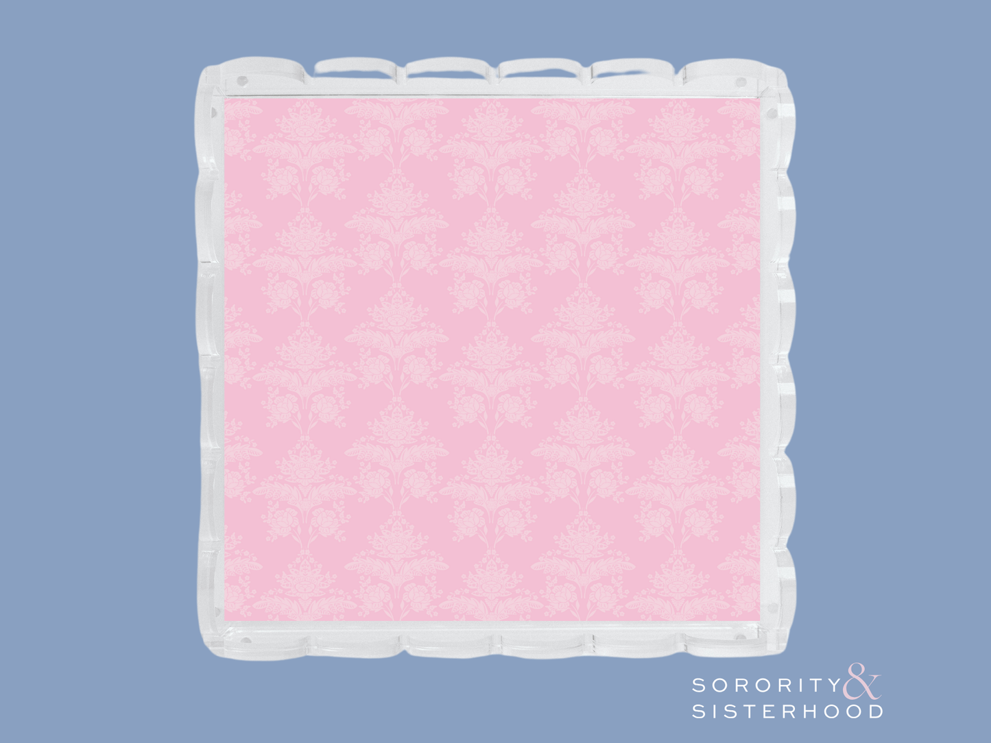 Square acrylic tray with scalloped edges and pink damask pattern interior.