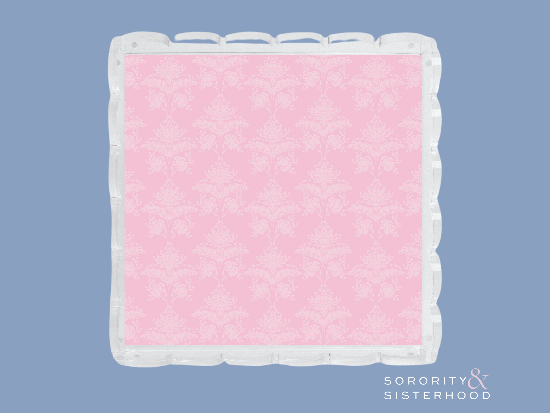 Square acrylic tray with scalloped edges and pink damask pattern interior.
