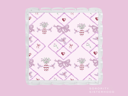 Square scalloped tray with pink lavender bow and heart pattern on white background.