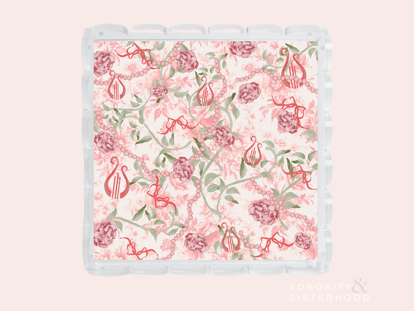 Acrylic tray with scalloped edges featuring a floral and Alpha Chi Omega symbol pattern in pink and green.
