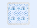Square acrylic tray with scalloped edges and blue floral diamond pattern design.