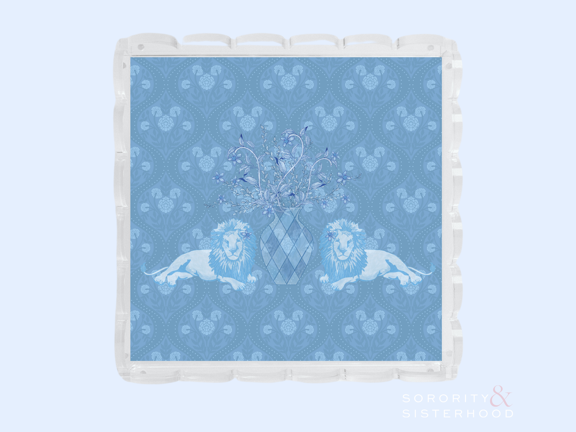 Clear acrylic tray with scalloped edges featuring a blue patterned insert with two lions and a central crest design.