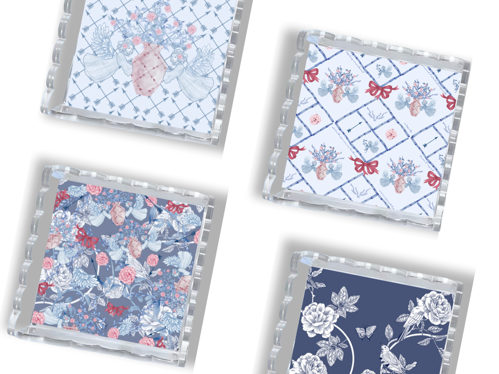 Four square acrylic trays with scalloped edges, featuring blue, white, and pink floral and geometric Pi Beta Phi designs.