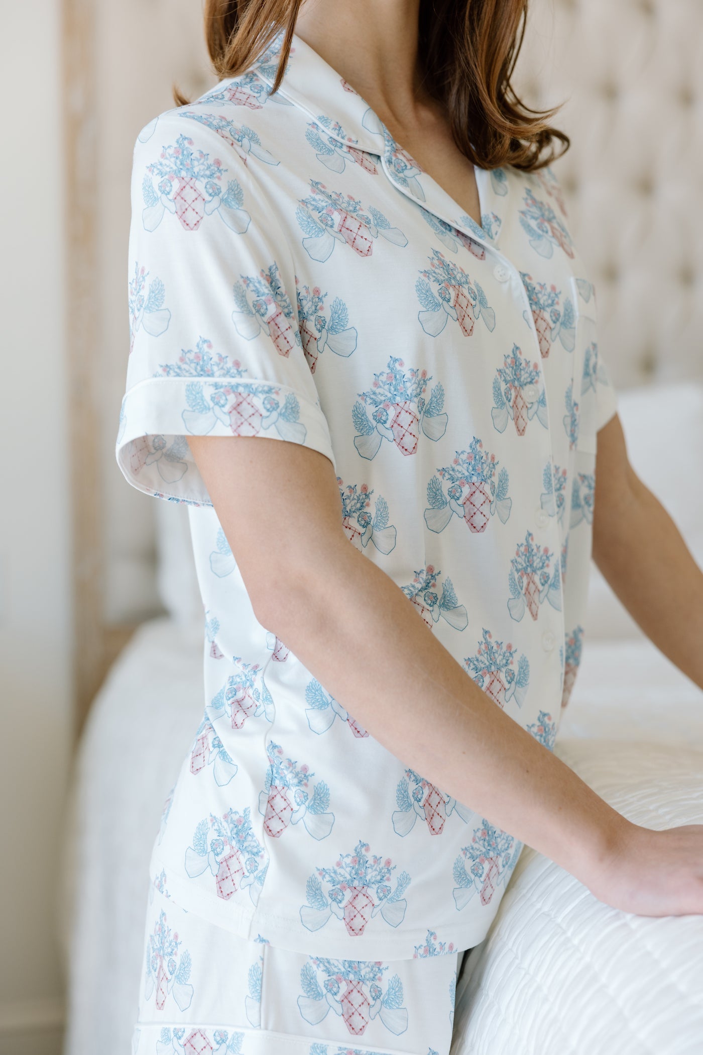 White short-sleeve pajama top with blue and pink floral print, relaxed fit.