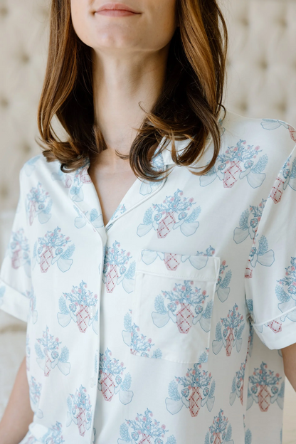 Light blue short-sleeve pajama top with pink and blue floral Pi Beta Phi print and chest pocket.