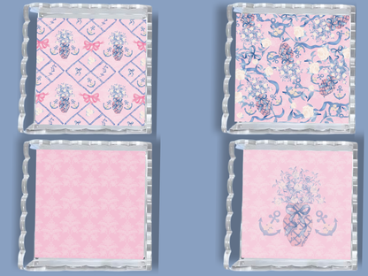 Set of two square acrylic trays with scalloped edges, featuring pink backgrounds and blue nautical and floral motifs.