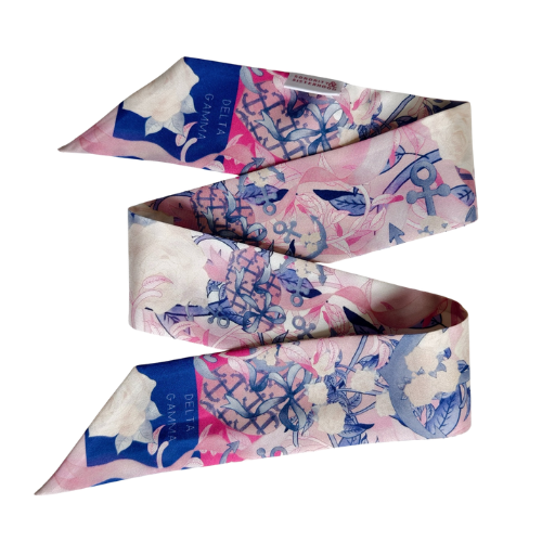 Pink and blue silk scarflette with floral and abstract patterns, narrow ends and Delta Gamma label.