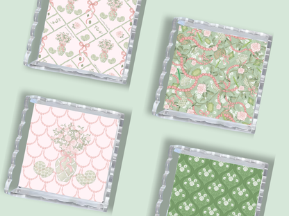 Set of four acrylic trays with scalloped edges, each featuring different pastel-colored patterns including anchors, floral.