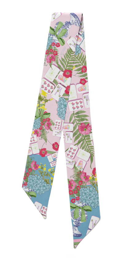 Silk scarflette with colorful Mahjong tile and floral pattern on pastel background.